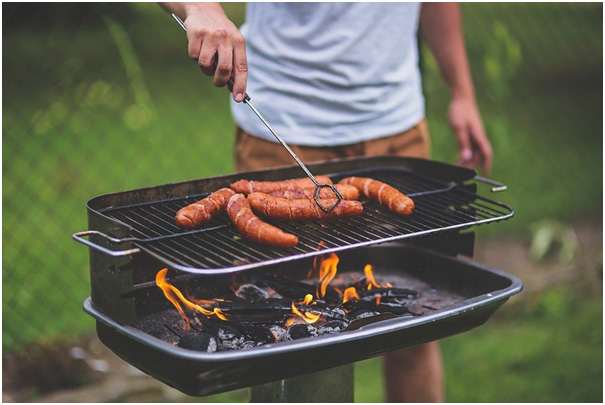 sausage on grill in open 